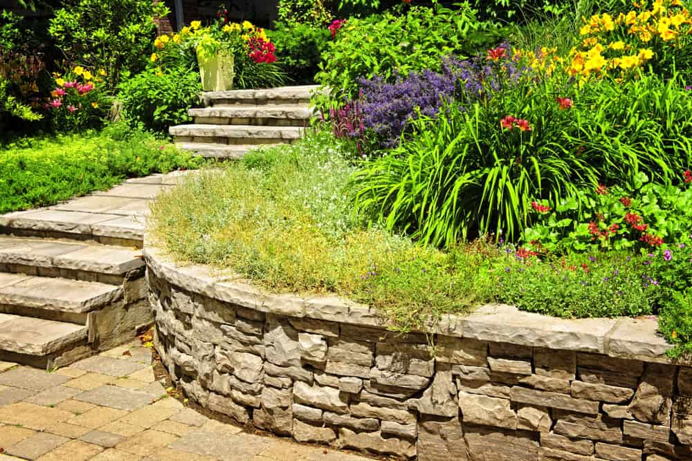 Natural stone landscaping with stairs and retaining walls